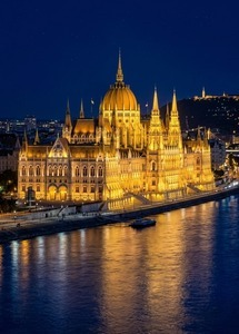 Hungarian Parliament illuminated beside the Danube in Budapest